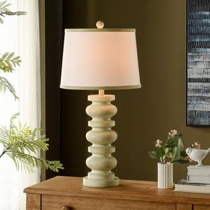 A room setting featuring Gambell Cream Table Lamp