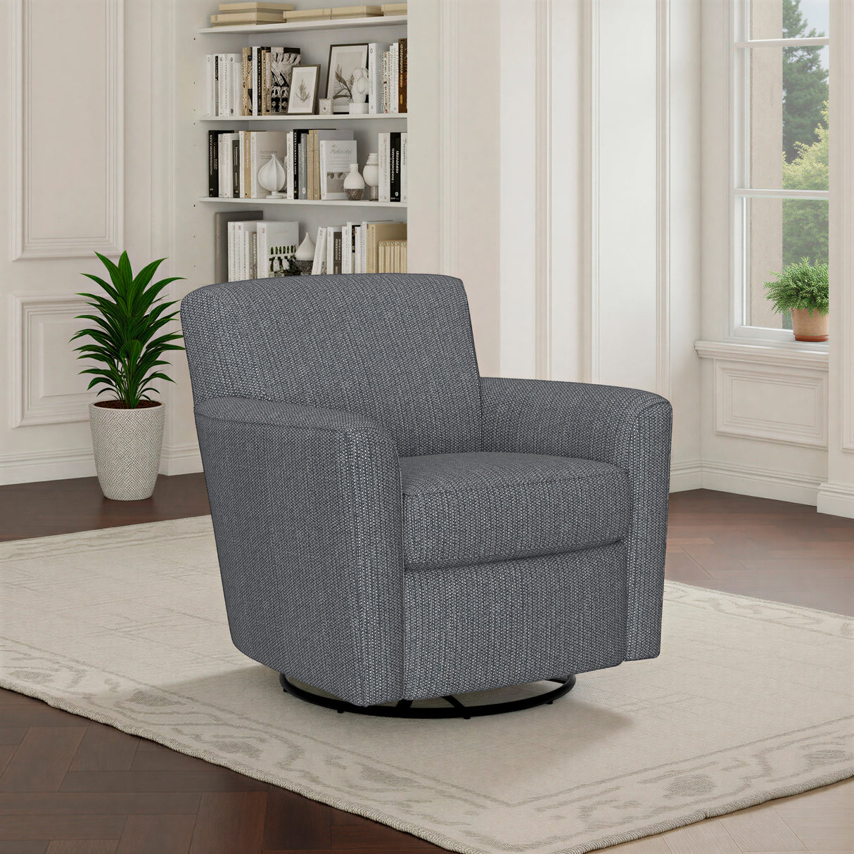 A room setting featuring Kingman Blue Swivel Glider