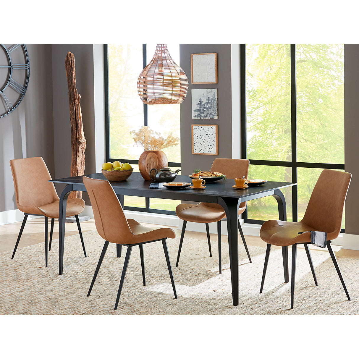 A room setting featuring Nicoya Black and Buckskin 5 Piece Dining Set