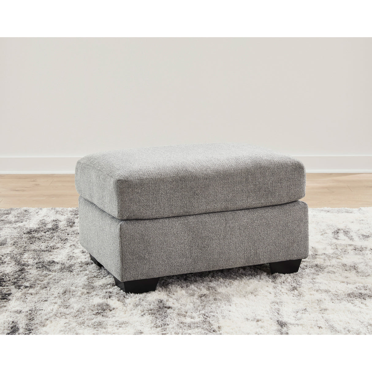 A room setting featuring Loreo Flint Ottoman