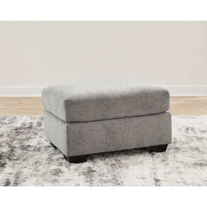 A room setting featuring Loreo Flint Ottoman