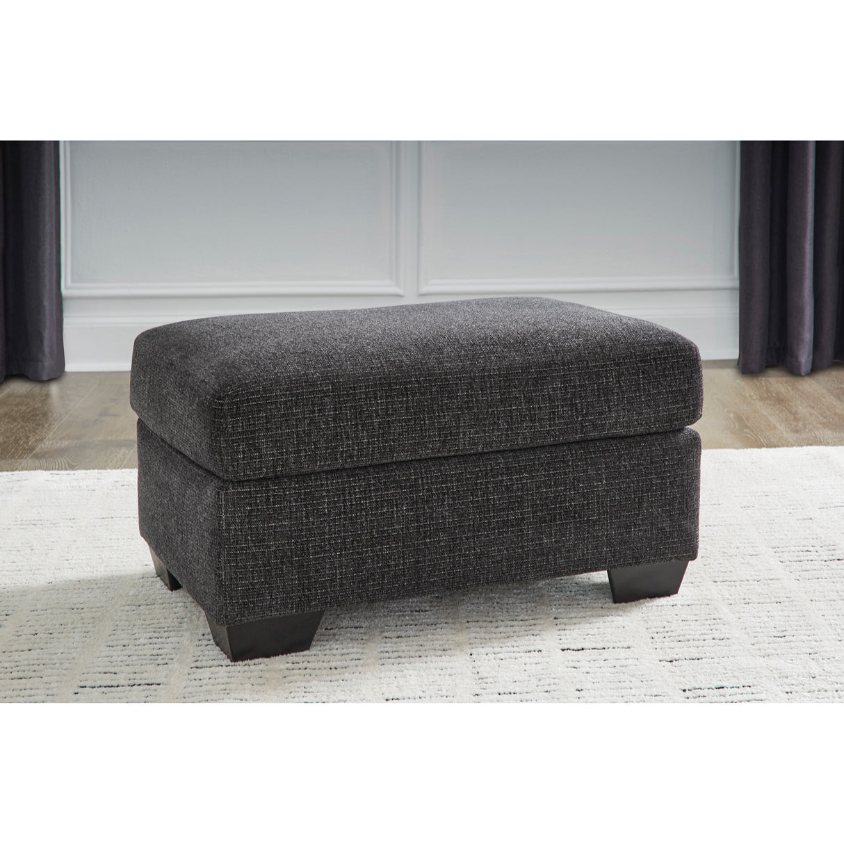 A room setting featuring Loreo Ebony Ottoman