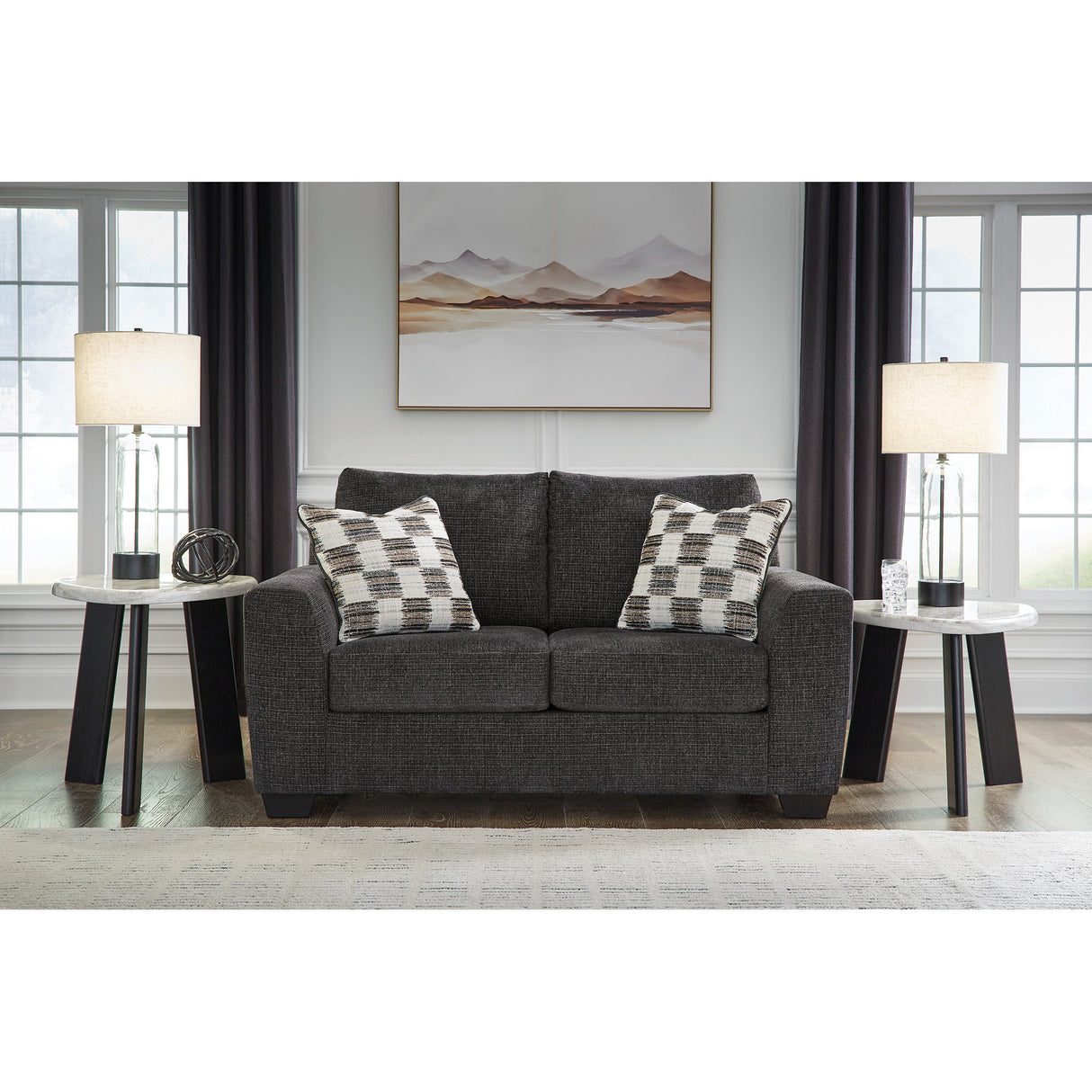 A room setting featuring Loreo Ebony Loveseat