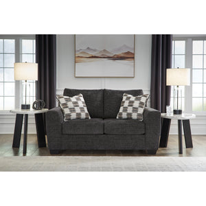 A room setting featuring Loreo Ebony Loveseat
