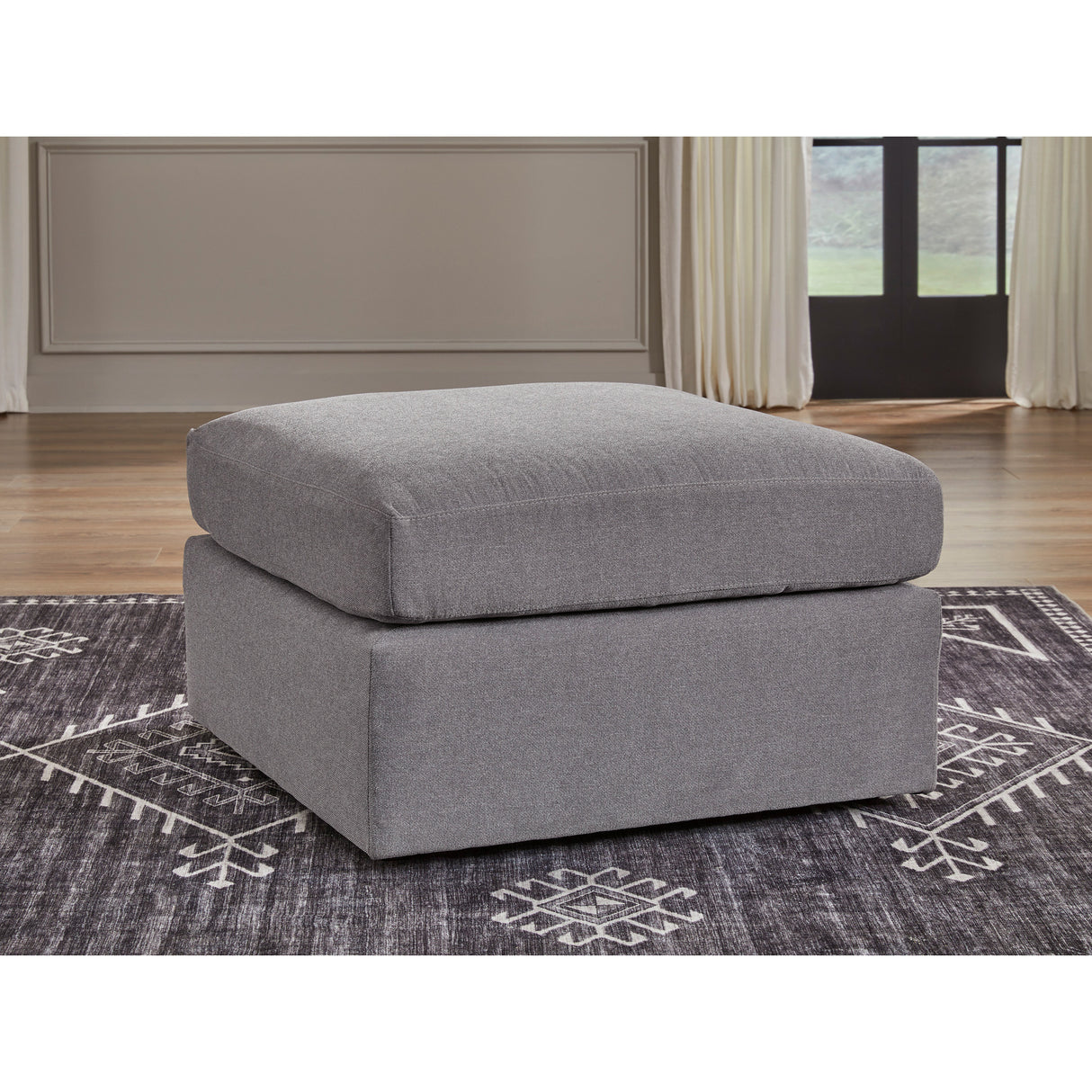 A room setting featuring Modmax Granite Ottoman