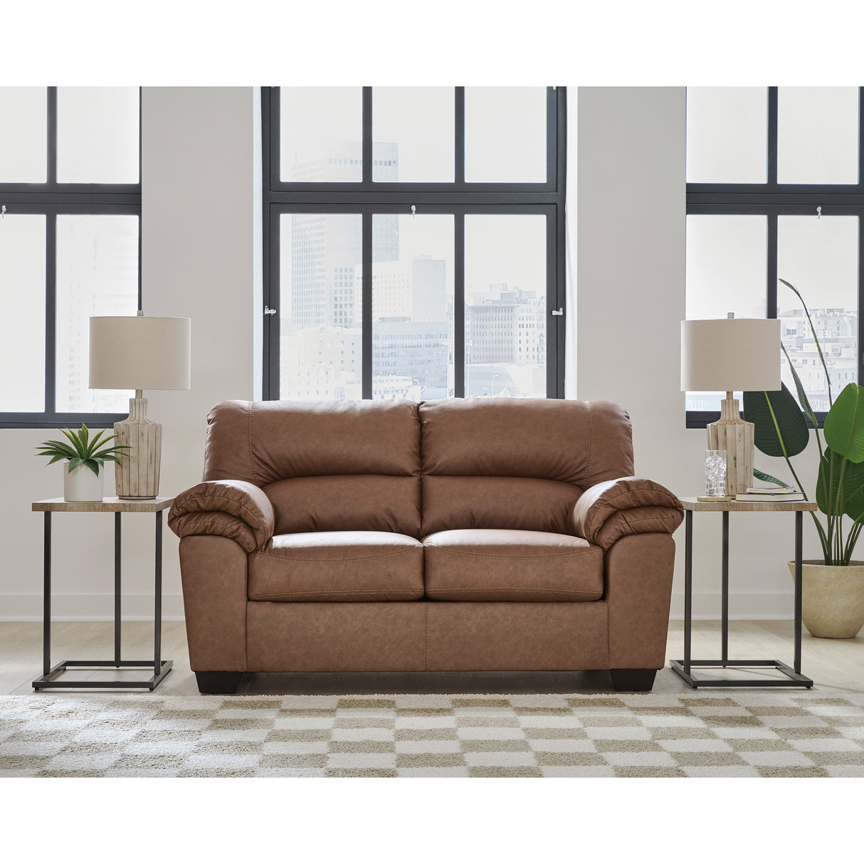 A room setting featuring Whitlock Caramel Loveseat