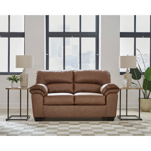 A room setting featuring Whitlock Caramel Loveseat
