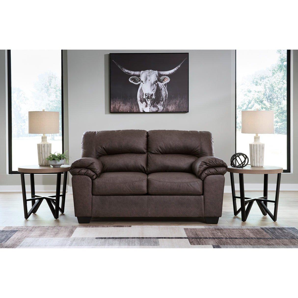A room setting featuring Whitlock Umber Loveseat