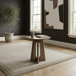 A room setting featuring Hendrix Natural Round End Table