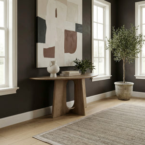 A room setting featuring Hendrix Natural Demilune Sofa Table