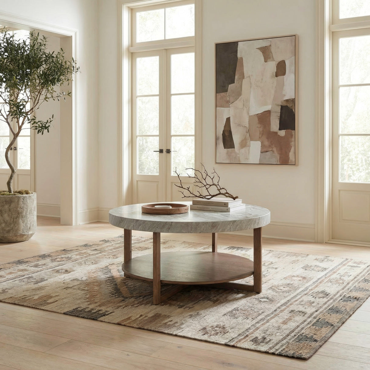 A room setting featuring Danby Alabaster Round Coffee Table