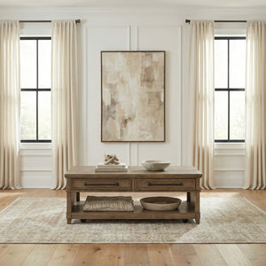 A room setting featuring Artisan Home Sienna Stone Rectangular Coffee Table