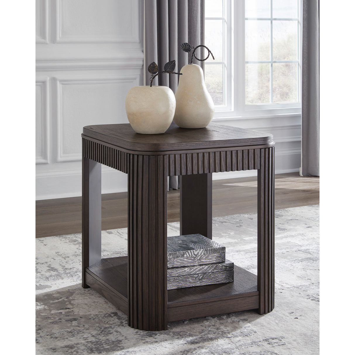 A room setting featuring Carlibrie Warm Brown Rectangular End Table