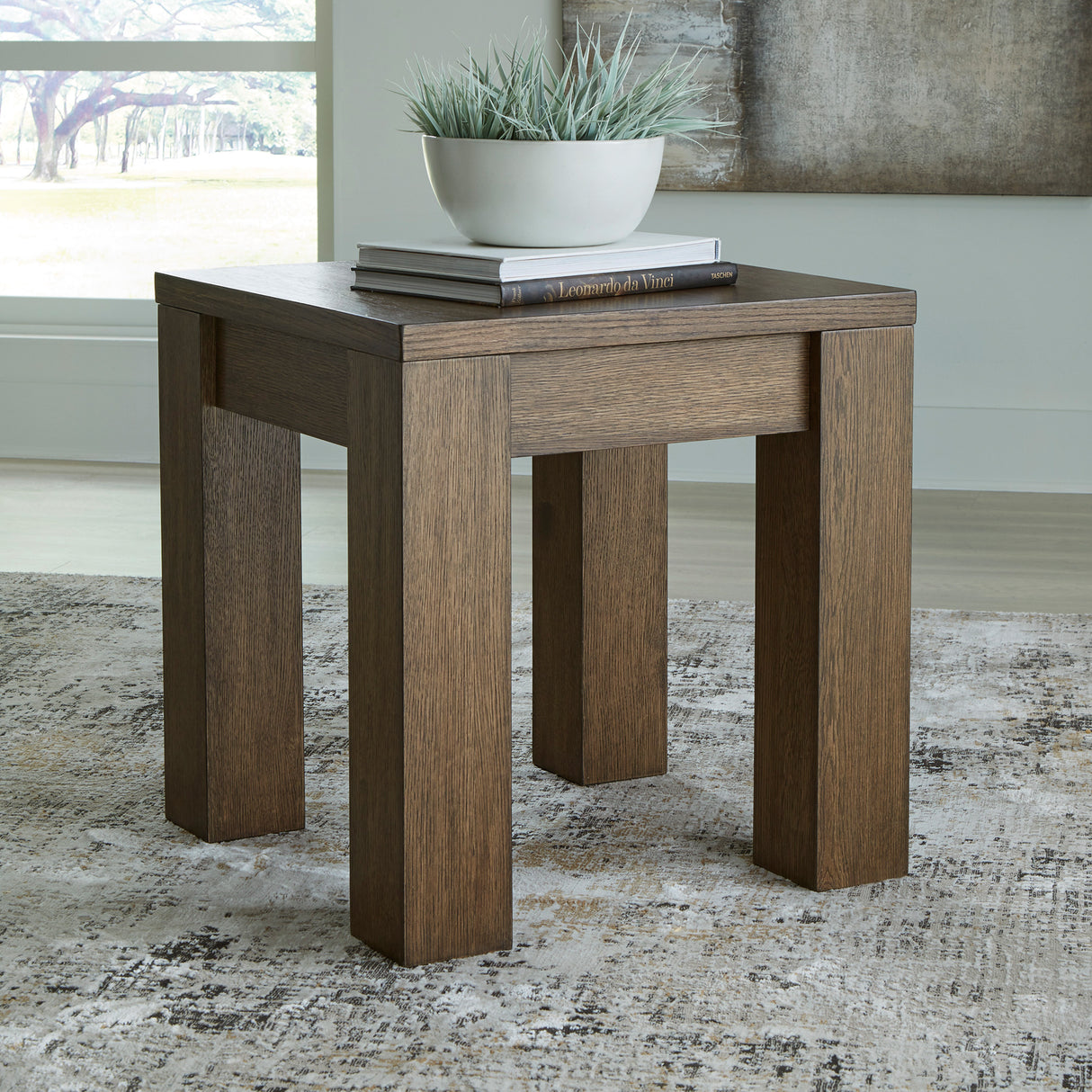 A room setting featuring Rosswain Warm Brown Square End Table