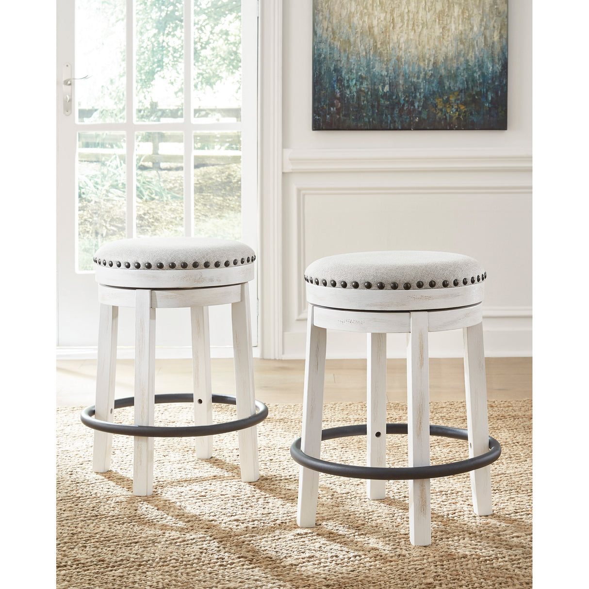 A room setting featuring Valebeck Antique White Backless Swivel Counter Stool
