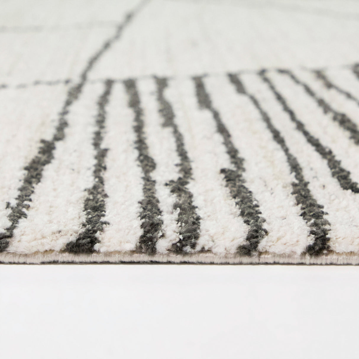 Side view of Barrell Charcoal 8x10 Abstract Rug
