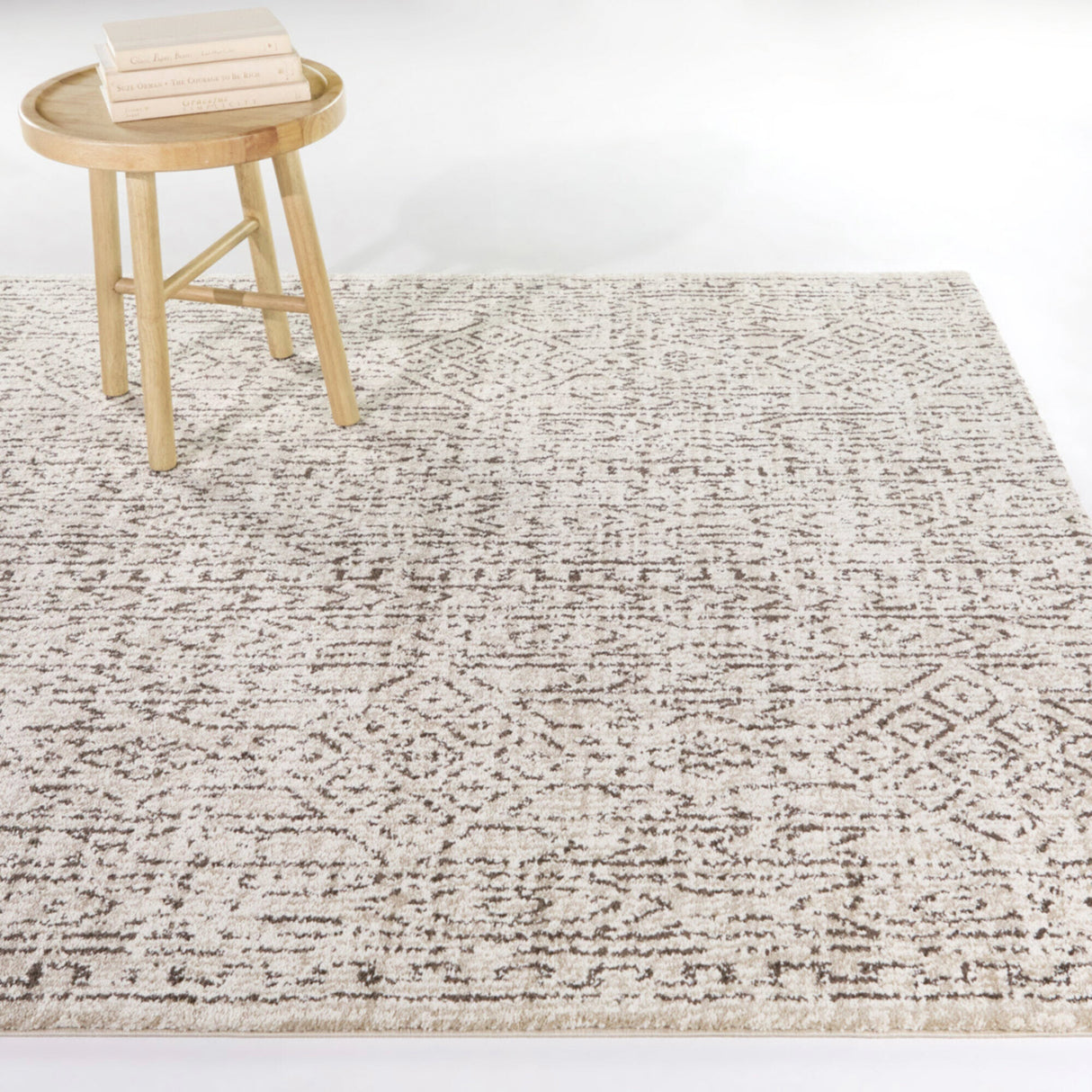 A room setting featuring Mari Moroccan Cream 8x10 Rug