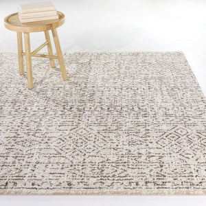 A room setting featuring Mari Moroccan Cream 8x10 Rug