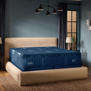 A room setting featuring Stearns and Foster Lux Estate Firm Hybrid II Split California King Mattress Set