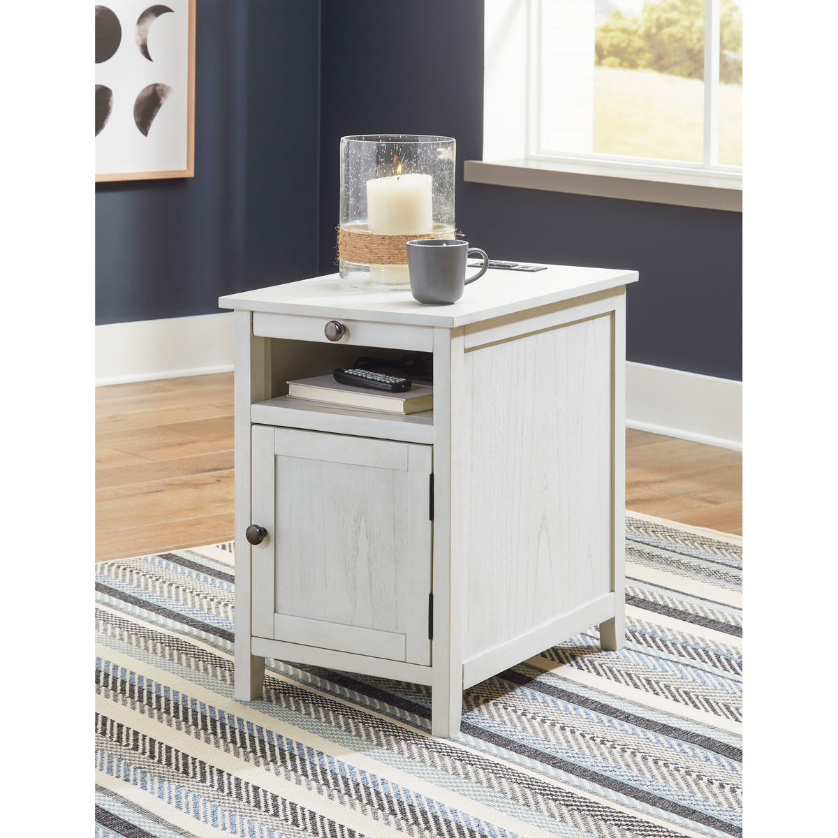 A room setting featuring Treytown Antique White Chairside End Table