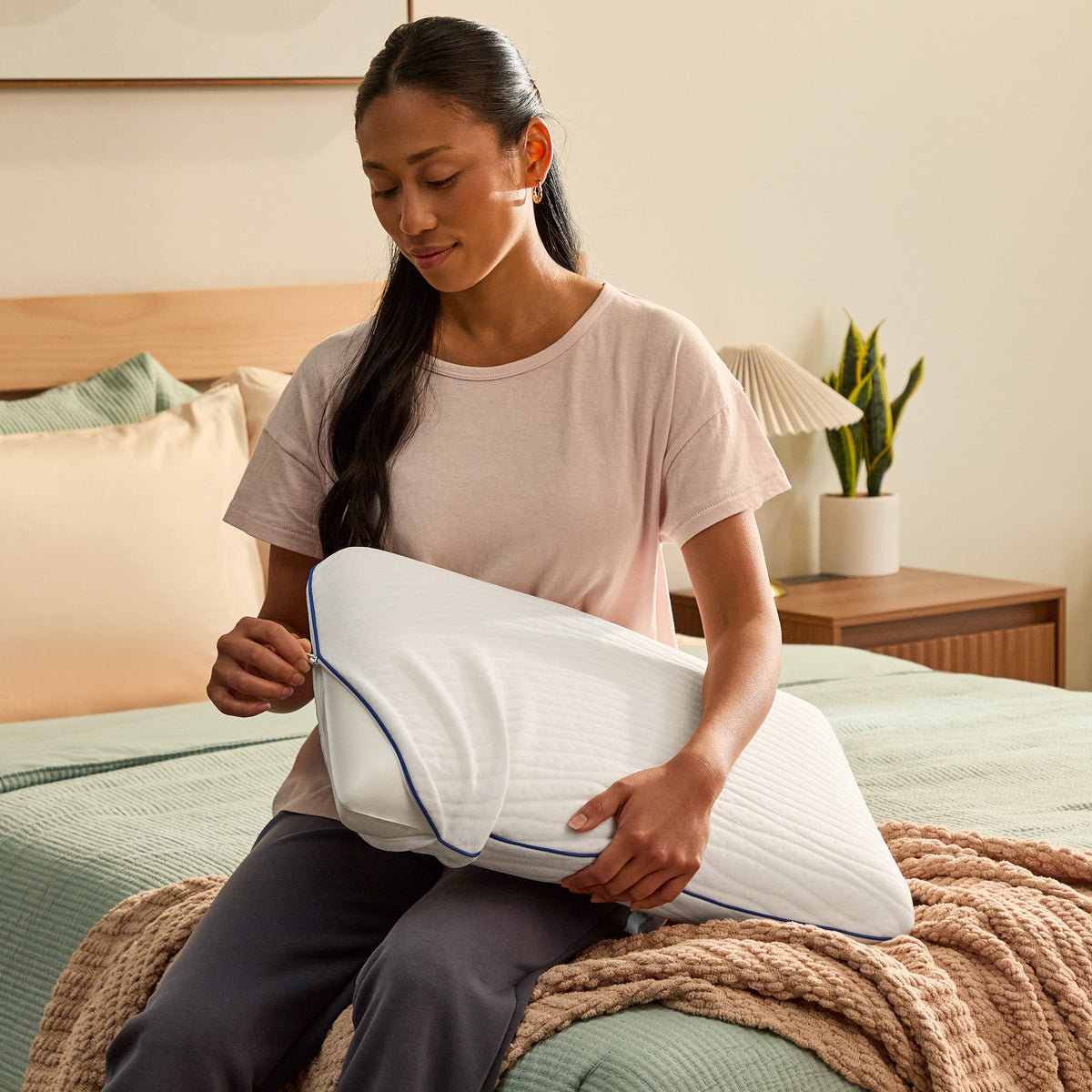 A room setting featuring Sealy Cooling Classic Memory Foam Queen Pillow