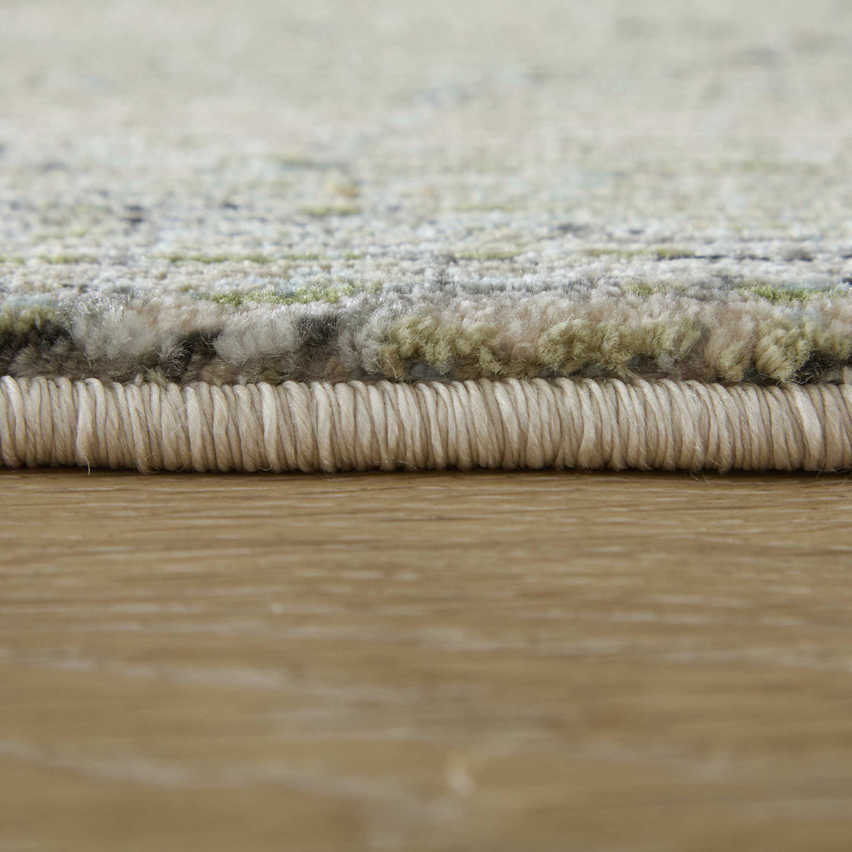 Side view of Sonora 39U8F Green 5x8 Rug