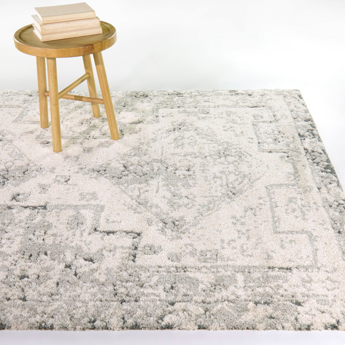 A room setting featuring Hilaeira Gray 5x8 Rug