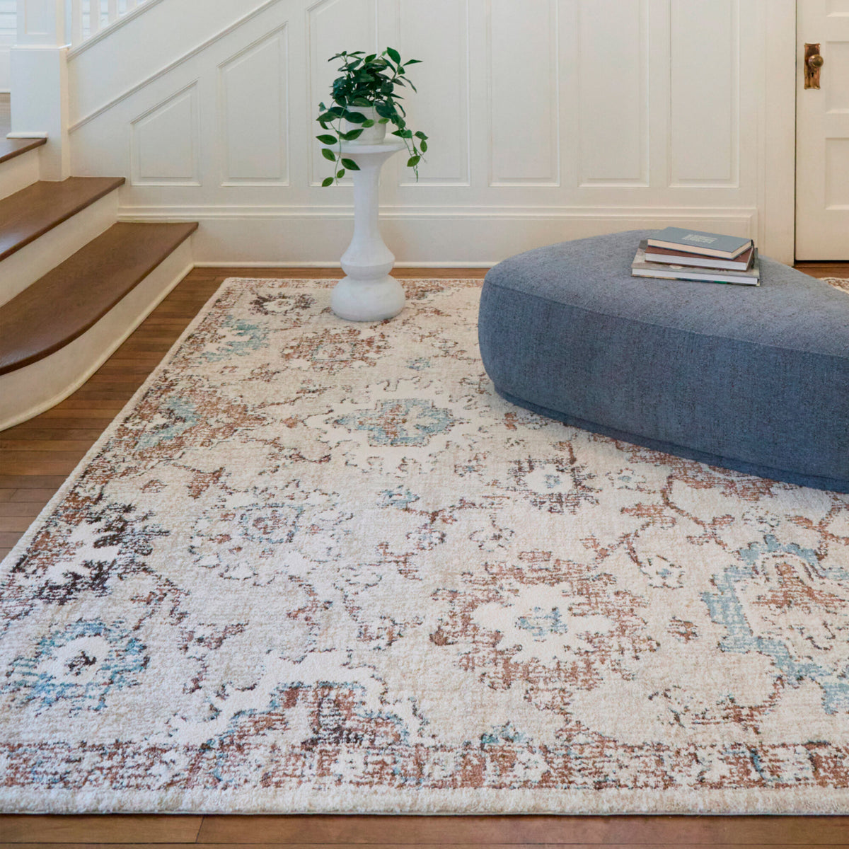 A room setting featuring Annan Cream 5x8 Rug
