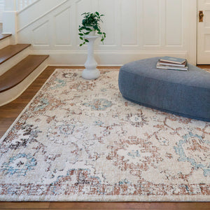 A room setting featuring Annan Cream 5x8 Rug