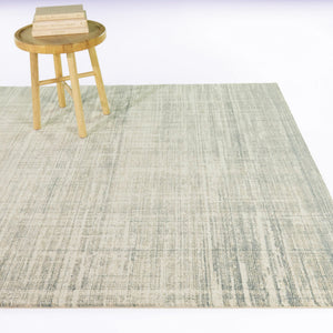 A room setting featuring Orlovsky Beige 8x10 Rug