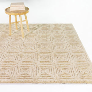 A room setting featuring Bolsena  Beige 5x8 Rug