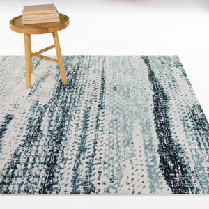 A room setting featuring Samuel Blue 5x8 Rug