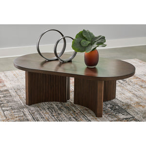 A room setting featuring Korestone Brown Oval Coffee Table