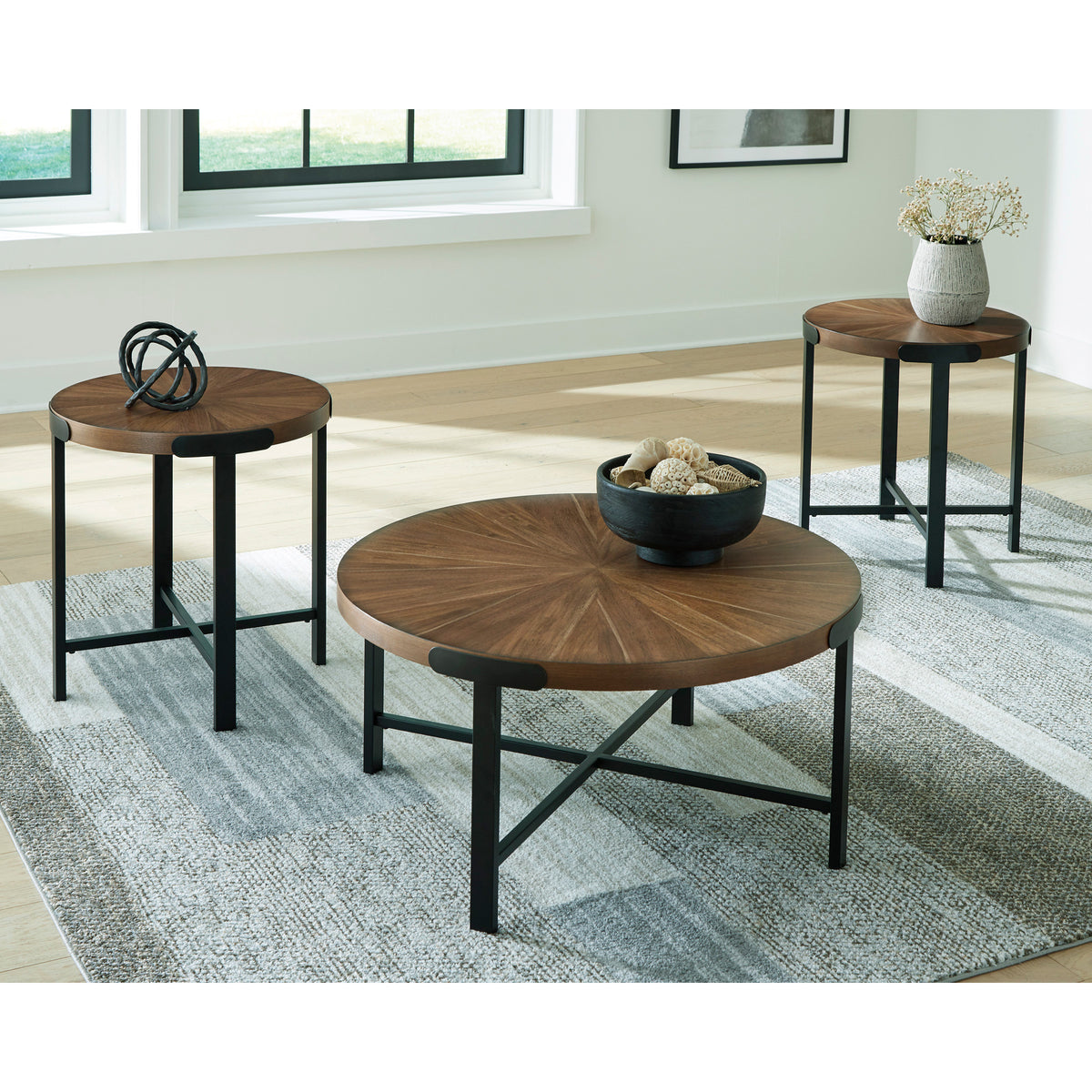 A room setting featuring Crosstrail Brown Set of 3 Tables