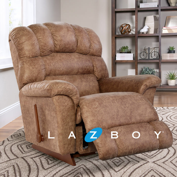 Brown recliner chair in a living room with 'La-Z-Boy' logo.