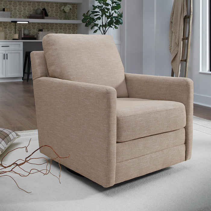 Beige armchair in a room with a kitchen in the background