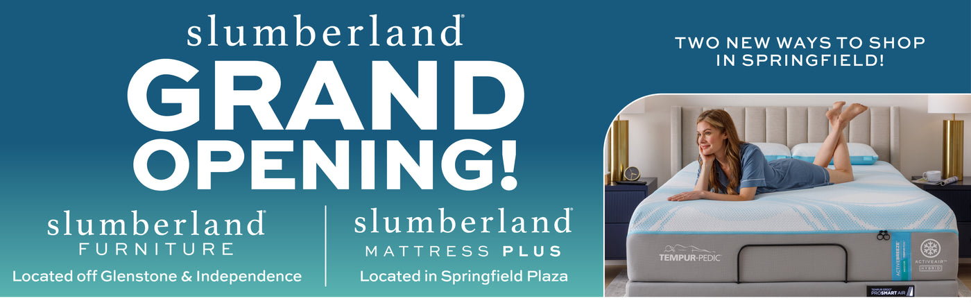 Advertisement for a lumberland furniture grand opening with promotional text and a couple on a bed.