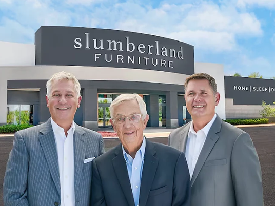 Slumberland founder and owners in front of store