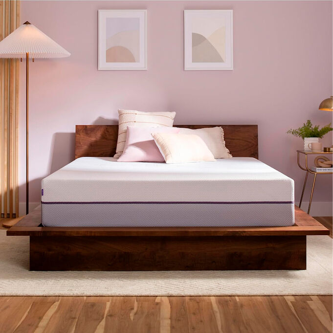 purple mattress on bed in room