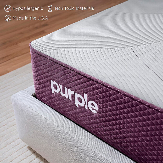purple logo on mattress
