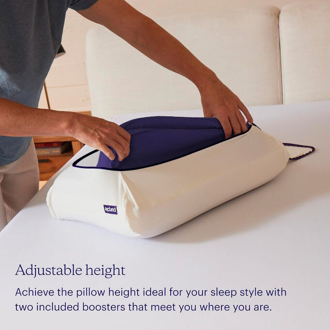 man adjusting height of pillow